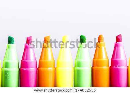 Group of felt tip bright color markers on white background