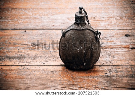 vintage old army bottle on the wood floor
