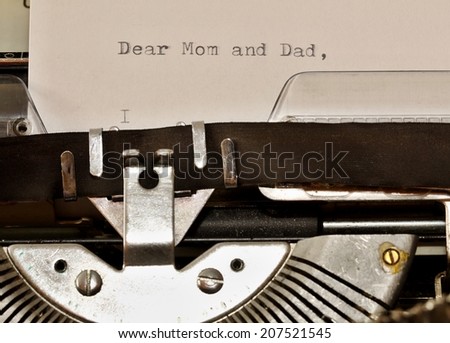 Letter with a title Dear Mom and Dad typed on old typewriter