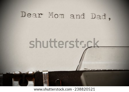 Letter with a title Dear Mom and Dad typed on old typewriter