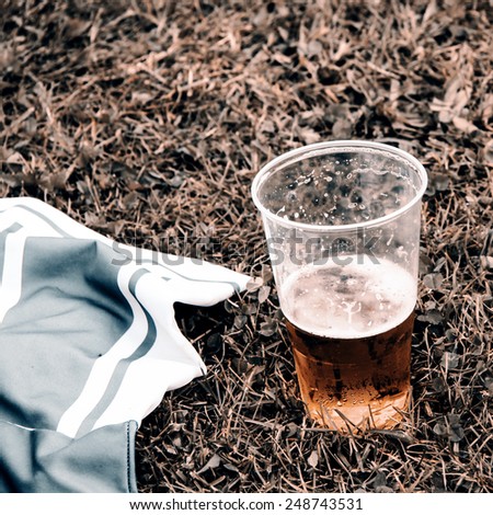 Beer and football dress on grass - retro style