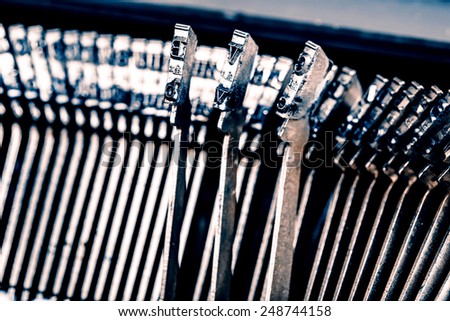 closeup of beautiful old typewriter letters - vintage or retro machine