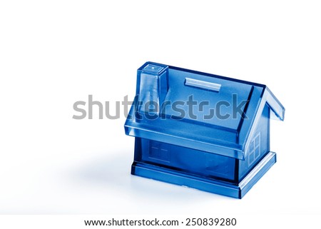 Blue House Money Box on White Background with coin - save money for own house concept