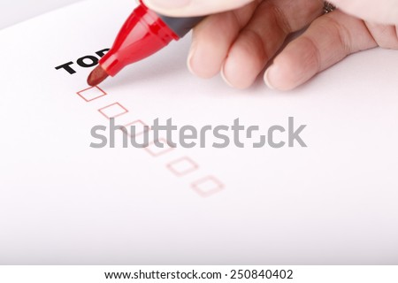 To Do list with check marks isolated on white - women hand with red marker