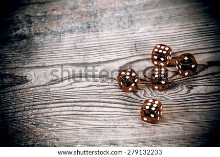 dice on the wooden table - triple six, one and five