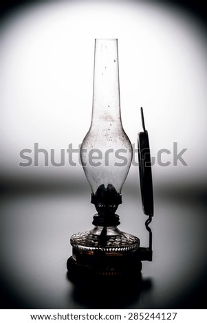 old kerosene lamp with mirror isolated on white background - retro