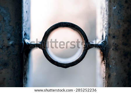Hole in the steel fence to the neighbors