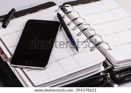 plan your future and business - calendar, planner, cellphone and pen