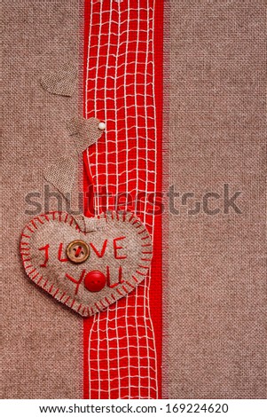Valentine background with hand-sewn heart with word I love You