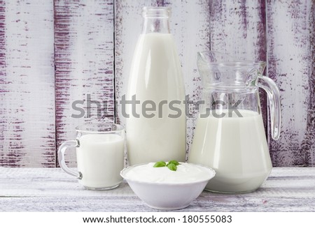 Milk and cream cheese on a vintage background