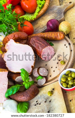 A variety of processed meat products with vegetables