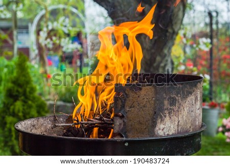 Lighting the fire during the spring barbecue in the garden