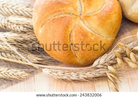 Different bakery products among the ears of cereals