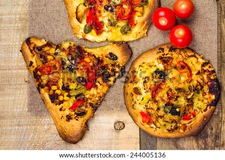 Closeup of a heavily toasted slices of pizza