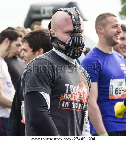Boughton House Northamptonshire/UK-May 4, 2013: Tough Mudder challenge and obstacle course raising funds for Help for Heroes.  A participant wears a scary face mask.