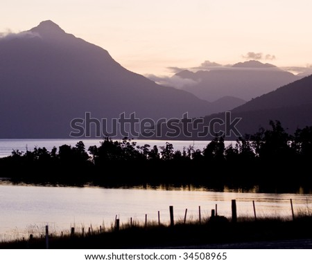 Dusk settles over mountains and water