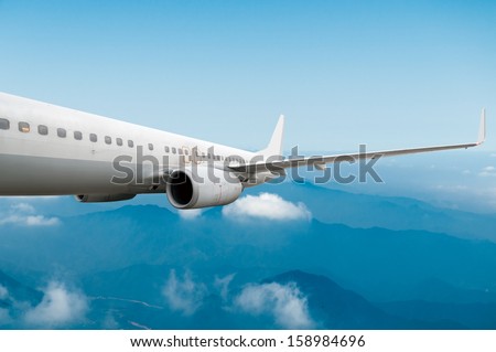 Passenger airliner flight in the blue sky Passenger airliner flight in the blue sky