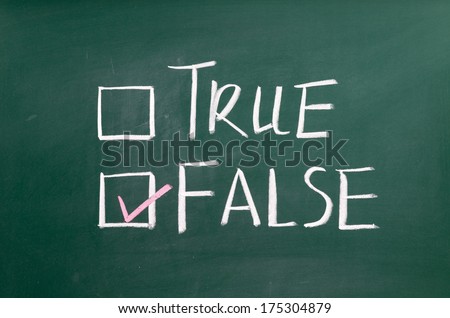 True or false written on a blackboard with white chalk.