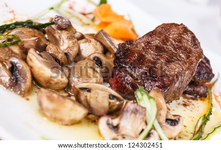 Beef steak with tasty mushrooms and truffle oil