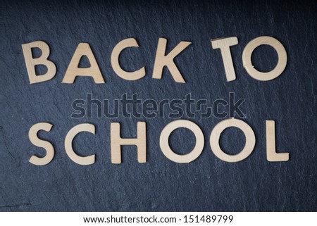 Back to school on slate background