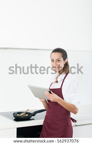 Young woman looking at a Recipe online