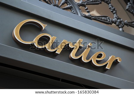 Florence, ITALY - December 8, 2011: Cartier Florence Store Logo Italy  mounted on the marble wall of Cartier Store at Via de\' Tornabuoni, the heart of Florence high-class shopping district