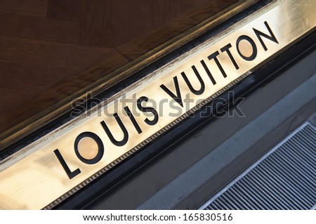 Florence, Italy - December 8, 2011: Louis Vuitton Florence Store Logo Italy Mounted On The Marble Wall Of Louis Vuitton Store At Via De\' Tornabuoni, The Heart Of Florence High-Class Shopping District