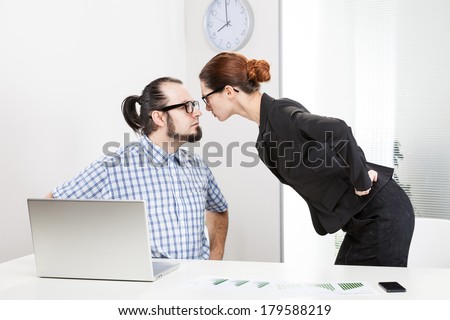 Angry businesswoman is slapping across the businessman\'s face