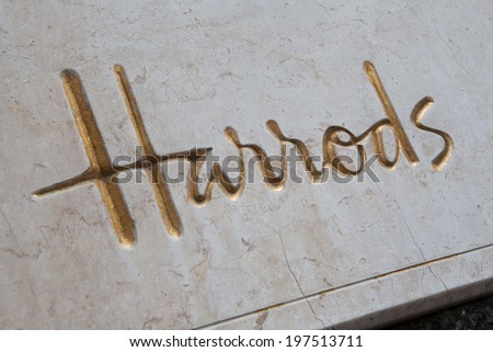 LONDON - MAY 5, 2012: Marble and Gold sign at the entrance of the famous Harrods Department Store in Knightsbridge London.