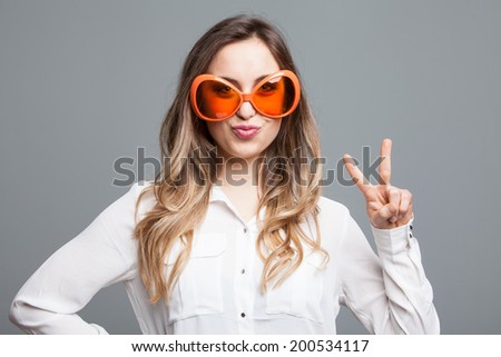 woman peace hand sign