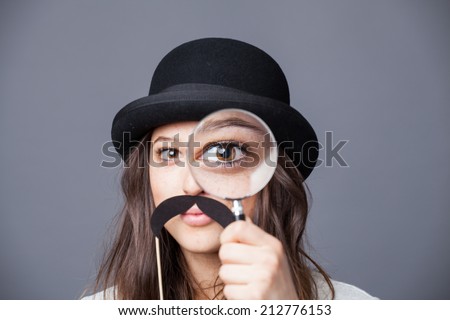 Detective woman with magnifying glass