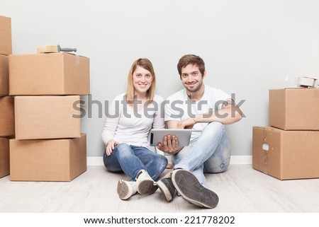 Smiling couple buying new furniture for their home