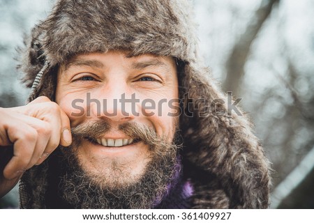 Portrait of a young handsome man with a beard. A person close-up of a bearded man. Face full face bearded.