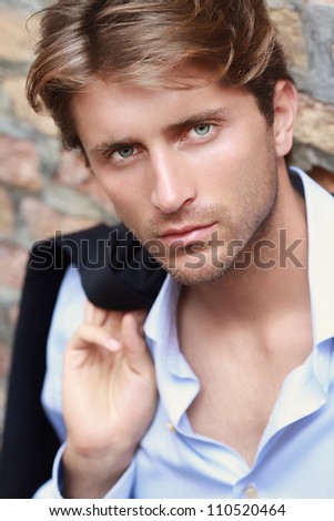 portrait of young man with impressing blue eyes