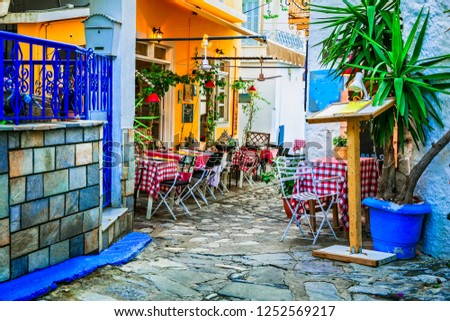 traditional colorful Greece series - cute taverns in narrow streets. Skiathos island