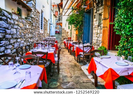 traditional colorful Greece series - cute taverns in narrow streets, Skiathos island