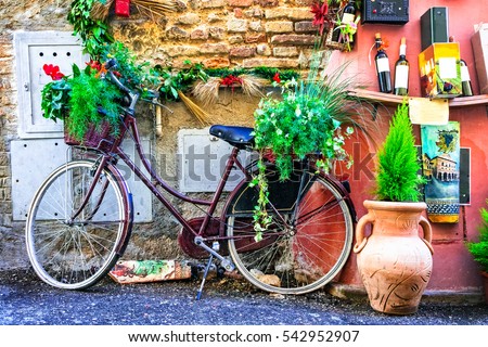 Floral bike- charming street decoration. streets of old italian villages