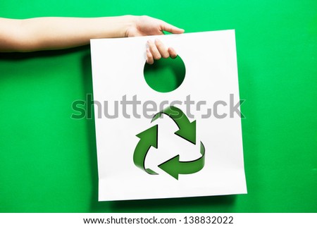 white shopping bag recycle symbol with hand
