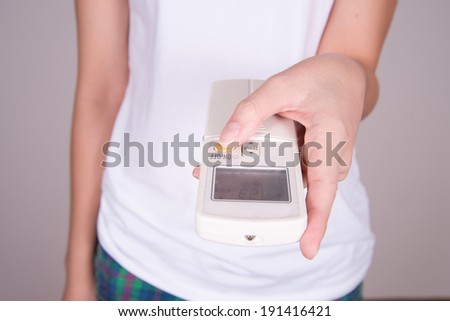 women hand turning on digital climate control