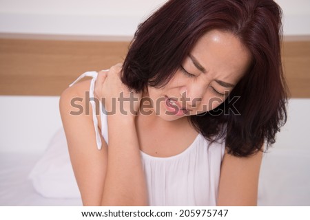 sick woman on bed concept of  suffering from neck pain
