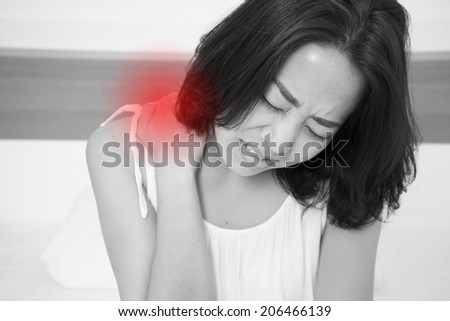 sick woman on bed concept of back pain,stomachache, headache, hangover, sleeplessness or insomnia with red alert accent