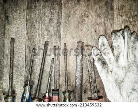 tool renovation on brown wood background with retro filter effect