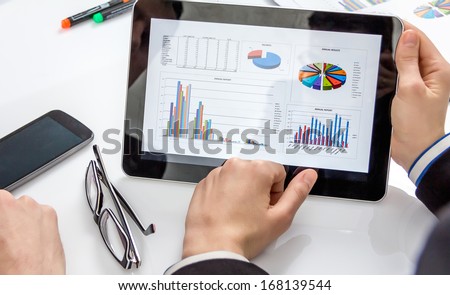 Business People Analyzing Financial Charts And Documents In A Meeting For The Success Of Company