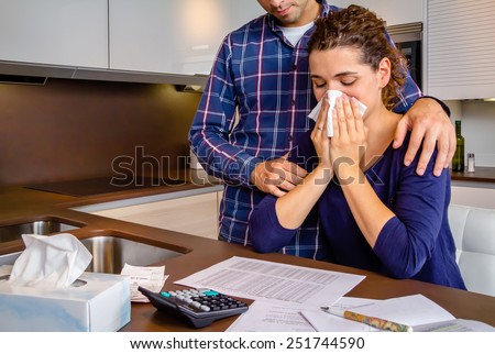 Young guy friend gives solace to desperate unemployed woman crying by her debts. Financial problems concept.