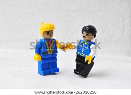 Hua Hin, Thailand - March 23 2015: Lego mini characters  on white. Lego is a popular line of construction toys manufactured by the Lego Group.