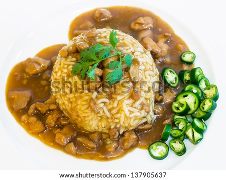 Rice with chinese style chicken in red sauce