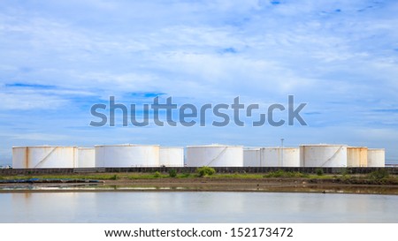 Large white tanks in tank farm for petrol and oil