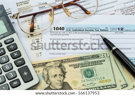 Tax Form With Pen, Calculator, Dollar Banknote , And Glasses Taxation Concept