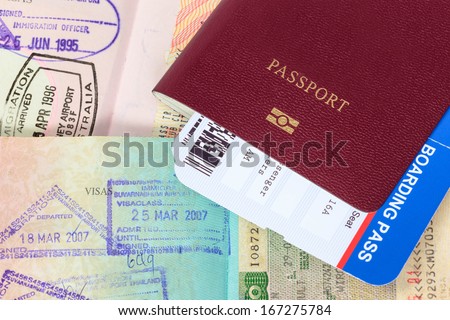 Passport, visa immigration stamps, and boarding pass