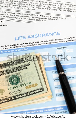 Life assurance application form with pen and banknote concept for life planning